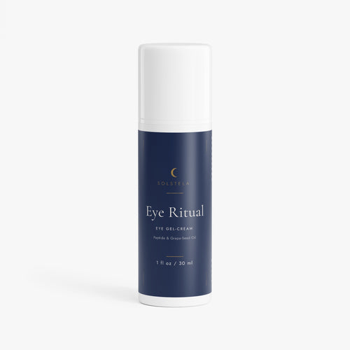 Solstela Eye Ritual eye gel-cream, navy airless pump bottle with a white cap, on a plain pale background